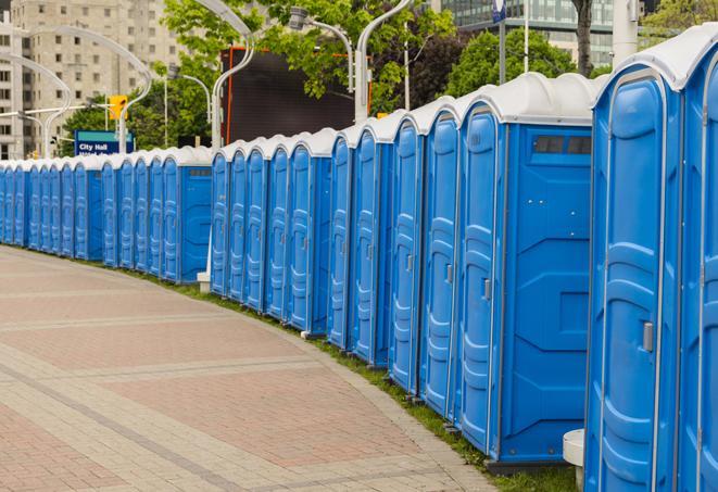 a row of portable restrooms at a fairground, offering visitors a clean and hassle-free experience in Dixon